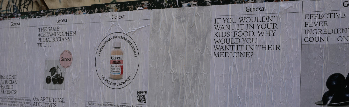 Advertisements on a wall with text and branding.