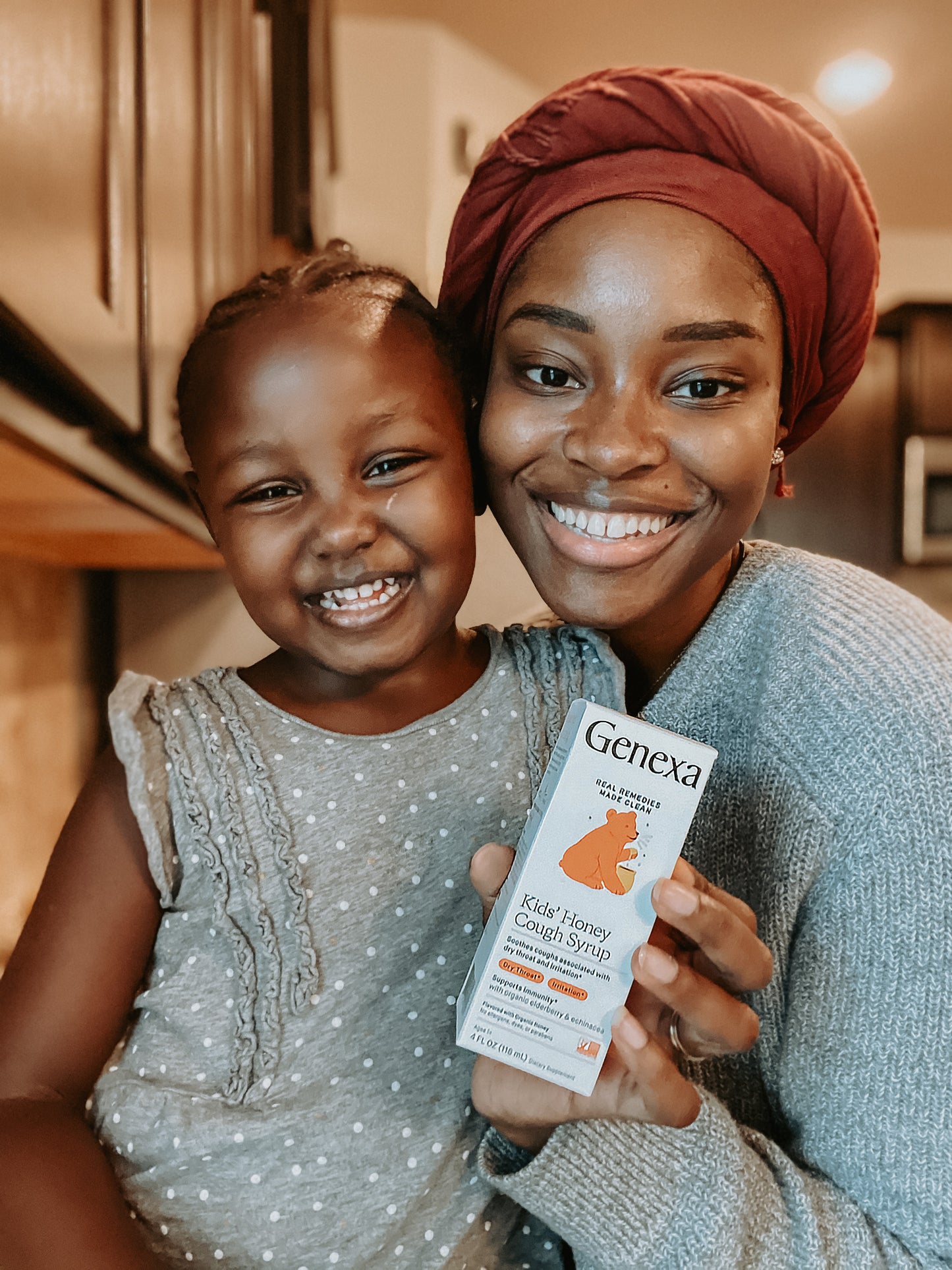 Woman and child holding a Genexa product in a kitchen setting